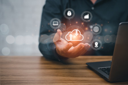 Man uses a laptop with a cloud computing diagram shown on hand. modern working technology, communication on the Internet. Business work and technology conceptの写真素材