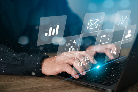 Document management concept, Businessman working with laptop computer and management icons on virtual screen make a plan for secure data storageの写真素材