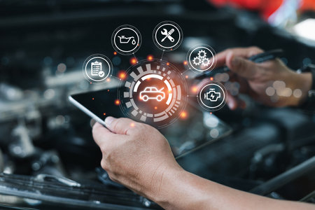 Car business concept and technology on virtual screen, Serviceman working onsite use tablet check service cycle for maintenance of car with the engine room in the background, Smartの写真素材