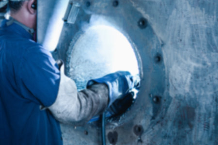 Blur concept photo: Welders repairing machines a machine damaged by welding repair work of industry work by electric weld machineの写真素材