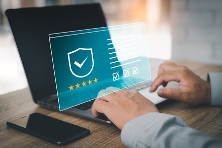 Customer service and Satisfaction Warranty concept, Businessman use laptops working in the office and virtual screens with customer ratings to service experience feedback surveyの写真素材