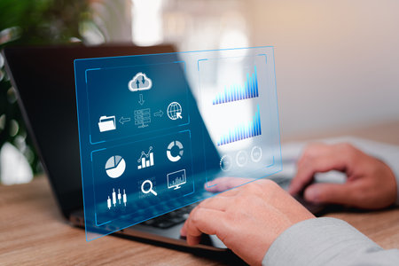 Businessman use laptops to work on smart digital marketing and data management, Business strategy concepts, automate operations, customer service management, marketing finance developments in businessの写真素材