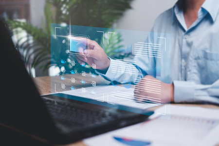 Business data management online and document system smart digital marketing analysis, Businessman pointing folder icon on virtual screen data management and business graph development informationの写真素材