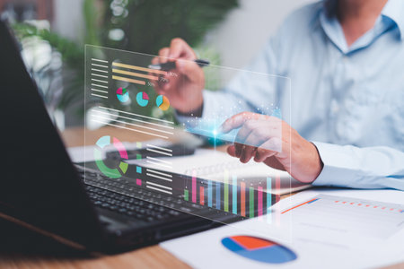 Businessman use laptops to work on smart digital marketing analysis and data management, Business strategy concept, Graph and marketing data Digital show on virtual screen and business managementの写真素材