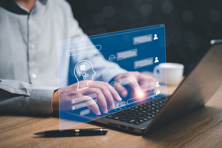 ChatGPT Chat with AI or Artificial Intelligence concept, Businessman use laptop chatting with a smart AI  chatbot developed by OpenAI,Obtain information and knowledge from automated systems technologyの写真素材