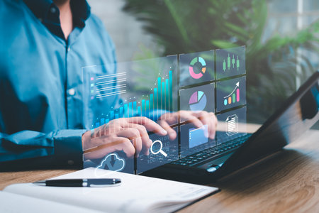 Smart digital marketing data management concept, Businessman use the laptop to work marketing analysis chart strategic planning for sustainable development and financial and investment competitionの写真素材