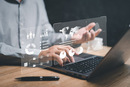 Smart digital marketing data management concept, Businessman use the laptop to work on marketing analysis chart strategic planning data management for sustainable developmentの写真素材