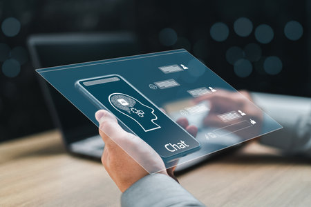 Bisinessman holding smartphone search for information using an artificial intelligence chatbot screen chat with AI or artificial intelligence concept.の写真素材