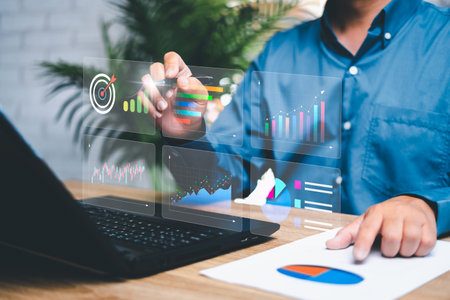 Strategic concept and management to achieve goals concept , Businessman pointing graph growth rate financially and business,  Statistics dashboard on virtual screen. Big data Graphs Chartsの写真素材