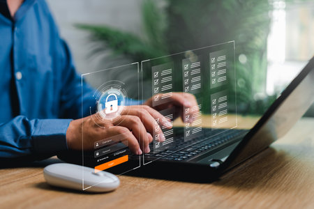 Cybersecurity privacy data protection concept and document management concept,Businessman use laptop secure encryption to access data and documents Safe storage of confidential data of company systemの写真素材
