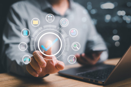 Businessman correct sign tick mark with business icon on the virtual screen for online approve paperless and quality assurance concept. quality assessment management with checklist, business documentの写真素材