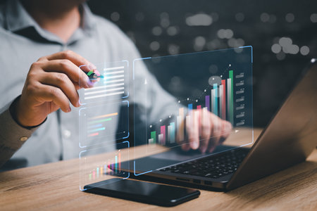 Analyzing business Enterprise and data management marketing financial organization strategy concept ,Businessman use laptop and show development of work through graph data for planning long termの写真素材
