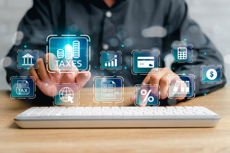 Financial research, government taxes, and calculation tax return concept, Businessman using desktop and  pointing on tax and Financial icon and use laptop keyboard input tax detail on virtual screenの写真素材