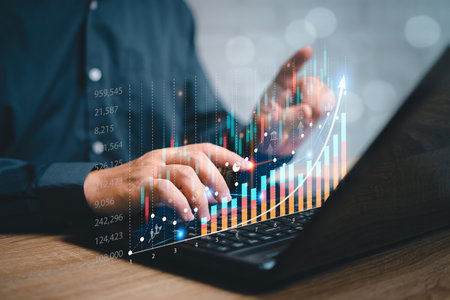Analyzing business Enterprise and data management marketing financial organization strategy concept ,Businessman use laptop and point development on stock market data and stock exchange, stock marketの写真素材
