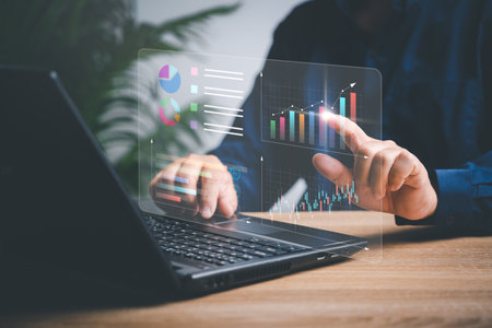 Businessman working on laptops to smart digital marketing on virtual screen, Analyzes the profitability of working companies with digital augmented reality graphics, and develop the organizationの写真素材