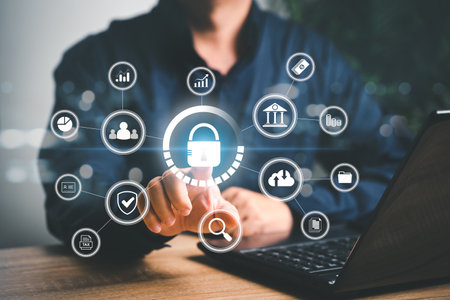 Cybersecurity and privacy protect data concept , Businessman use laptop and point on lock icon  internet network security technology protecting personal data with business icon on screenの写真素材
