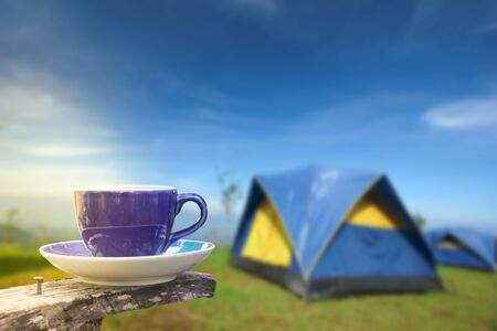 Coffee in a cup on balcony with nature and mountain backgroundの写真素材