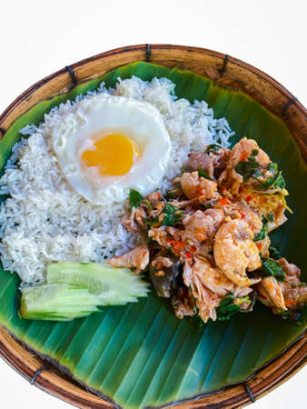 Rice topped with stir-fried pork or beef and basil for sale at Thai street food market or restaurant in Bangkok Thailandの写真素材