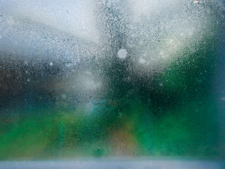 Water drops steam of rain on window glass after the rainの写真素材