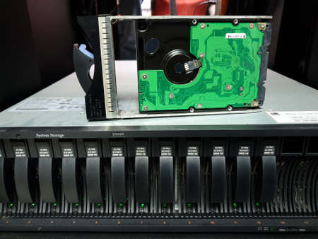 Bangkok, Thailand - August 18, 2021 : Installing hard disk raid storage to computer Server mainframe in datacenter.のeditorial素材