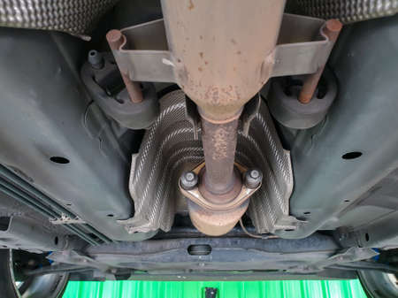 Bangkok, Thailand - August 7, 2021 : Unidentified car mechanic or serviceman disassembly and checking a disc brake and asbestos brake pads for fix and repair problem at car garage or repair shopのeditorial素材