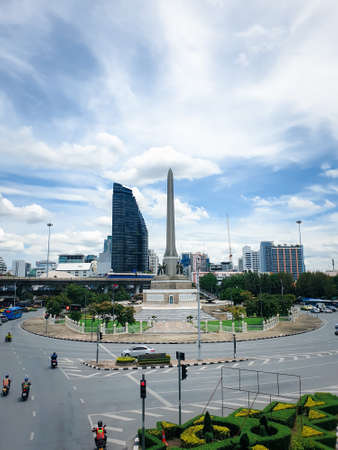 Bangkok, Thailand - July 31, 2020 : Cityscape and Victory Monument with BTS skytrain and traffic in daytime. Victory Monument is a large military monument in Bangkok, Thailand.のeditorial素材