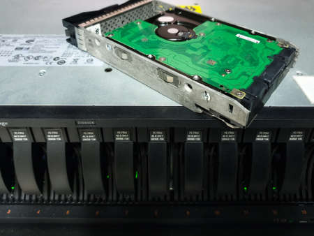 Bangkok, Thailand - August 18, 2021 : Installing hard disk raid storage to computer Server mainframe in datacenter.のeditorial素材