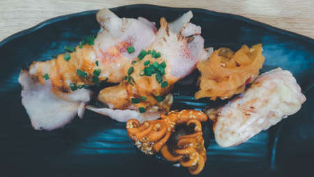Japanese food in set different types of sushi with seaweed salad and gari (ginger) is a healthy food...
