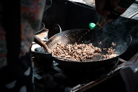 Rice topped with stir-fried pork or beef and basil for sale at Thai street food market or restaurant in Bangkok Thailandの写真素材