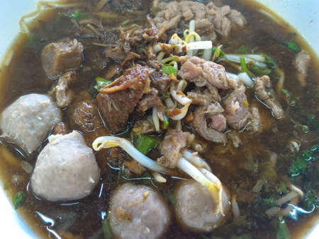 beef soup with meat ball, street food in Thailand