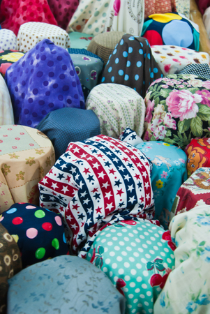 Closeup of various fabric bolts in storeの写真素材