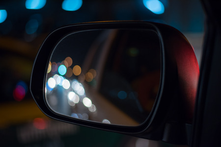 Left Wing Mirror Car and more Clourfull Bokeh Background in City night on the streetの写真素材