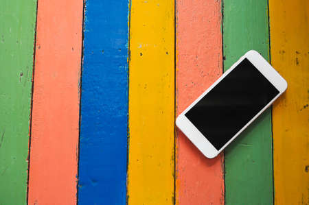 Background wood colorful  and phoneの写真素材