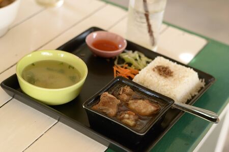 A set of asian food roasted pork with steamed rice