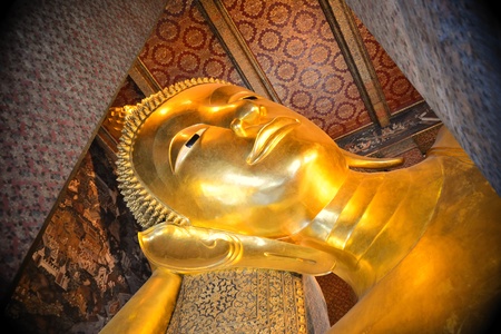 Close up face of the reclining buddha in Thailandの写真素材