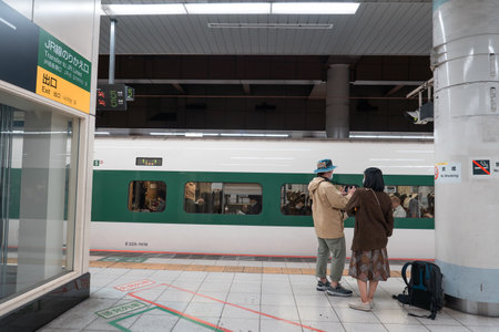 TOKYO, JAPAN - APRIL 10, 2023: E5 series shinkansen on a Yamabiko service to Sendai at Ueno station.のeditorial素材