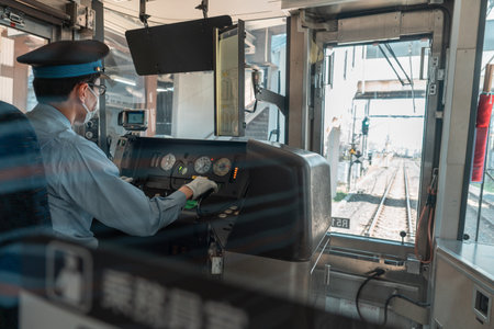 Asian male train driver on workplace, view from behindのeditorial素材
