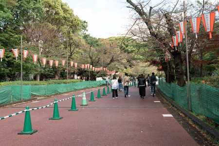 TOKYO, JAPAN - APRIL 8, 2023: People walking in Ueno park during springtime in Aprilのeditorial素材