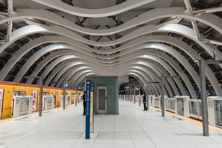 TOKYO, JAPAN - APRIL 8, 2023: Tokyoâs Shibuya station platform with M-shaped white ceilingのeditorial素材
