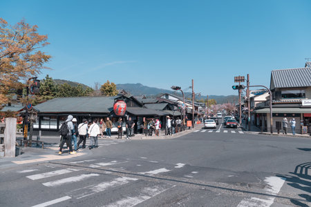KYOTO, JAPAN - April 4, 2023: Tourist walking at Arashiyama district tourist shopping areaのeditorial素材