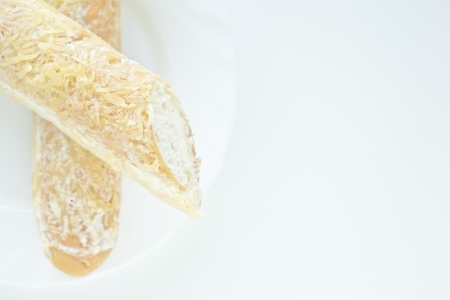 These cheese breadsticks or cheesy breadsticks are very delicious and easily to baked at home. Moreover, these breadsticks have vanilla cream inside and topping with cheese.の写真素材