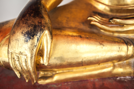 Buddha's left hand rests on his lap in a gesture of givingの写真素材