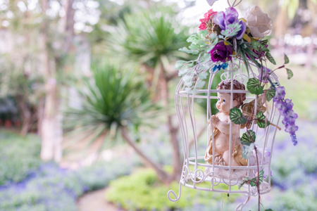 Gorgeous vintage birdcage with flowerの写真素材