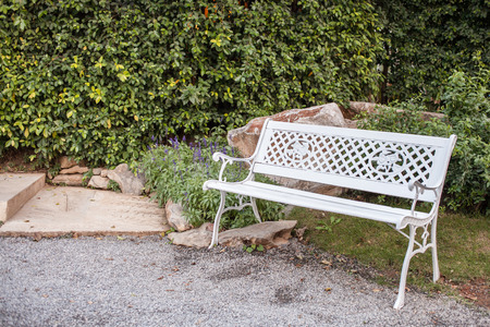 White bench seat in gardenの写真素材