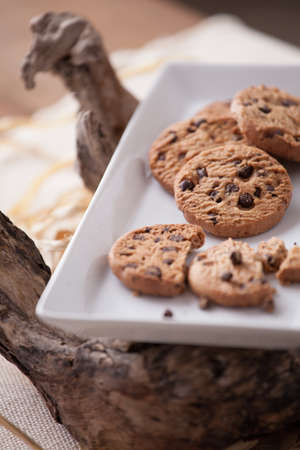 Delicious chocolate chip cookies on wood tableの写真素材