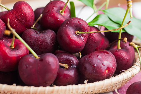 Closeup many  fresh cherry in basketの写真素材