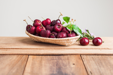 Closeup many  fresh cherry in basketの写真素材