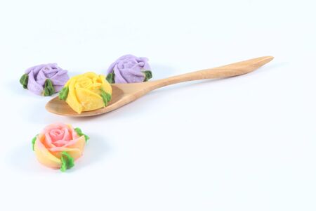 Allauch candy roses wooden spoon on white backgroundの写真素材