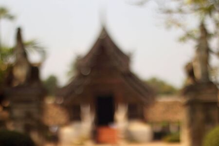 blur image of Wat Ton Kain, Old temple made from wood in Chiang Mai Thailand.の写真素材