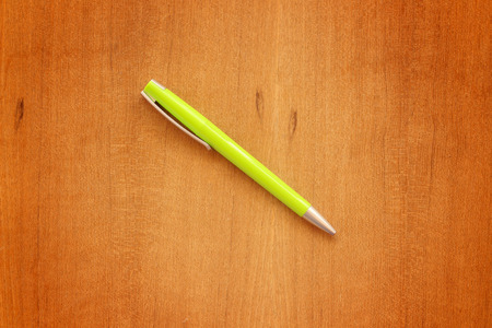 pen on the wooden tableの写真素材